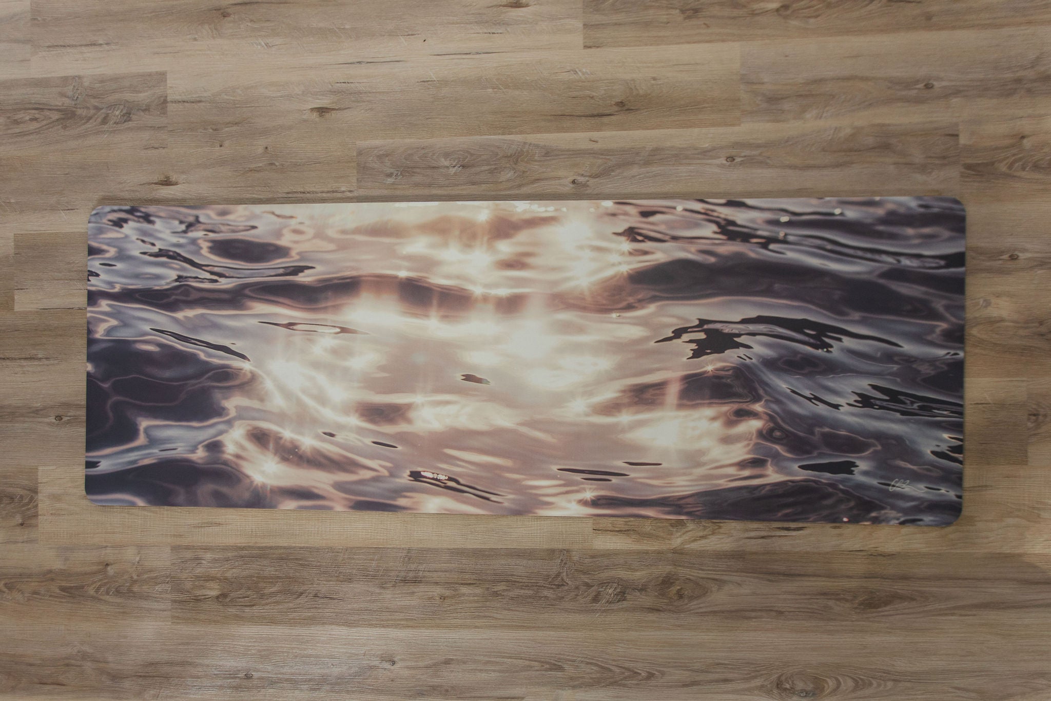Yoga mat with abstract design on a wooden floor