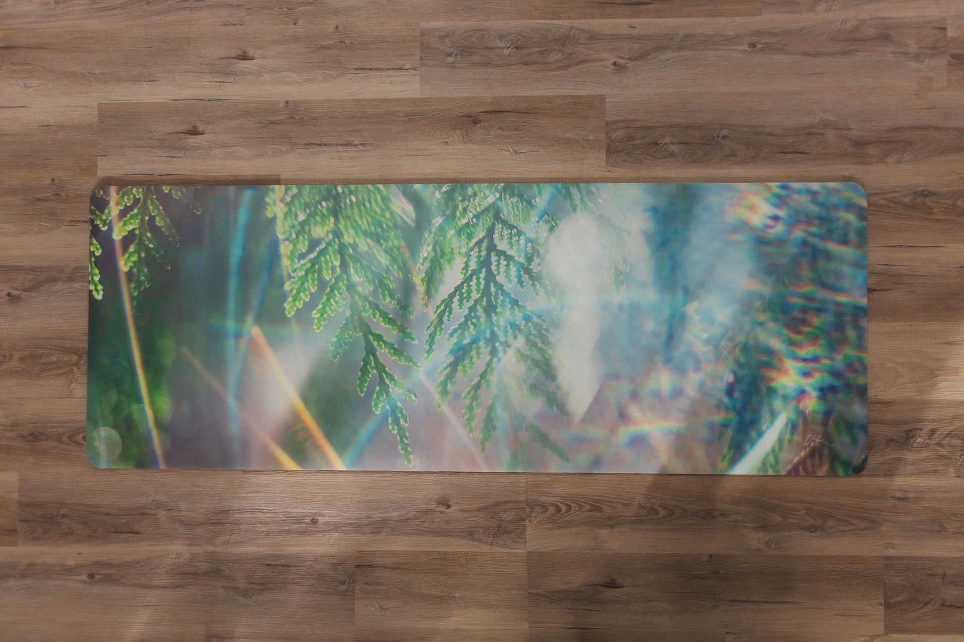 Yoga mat with nature design on a wooden floor