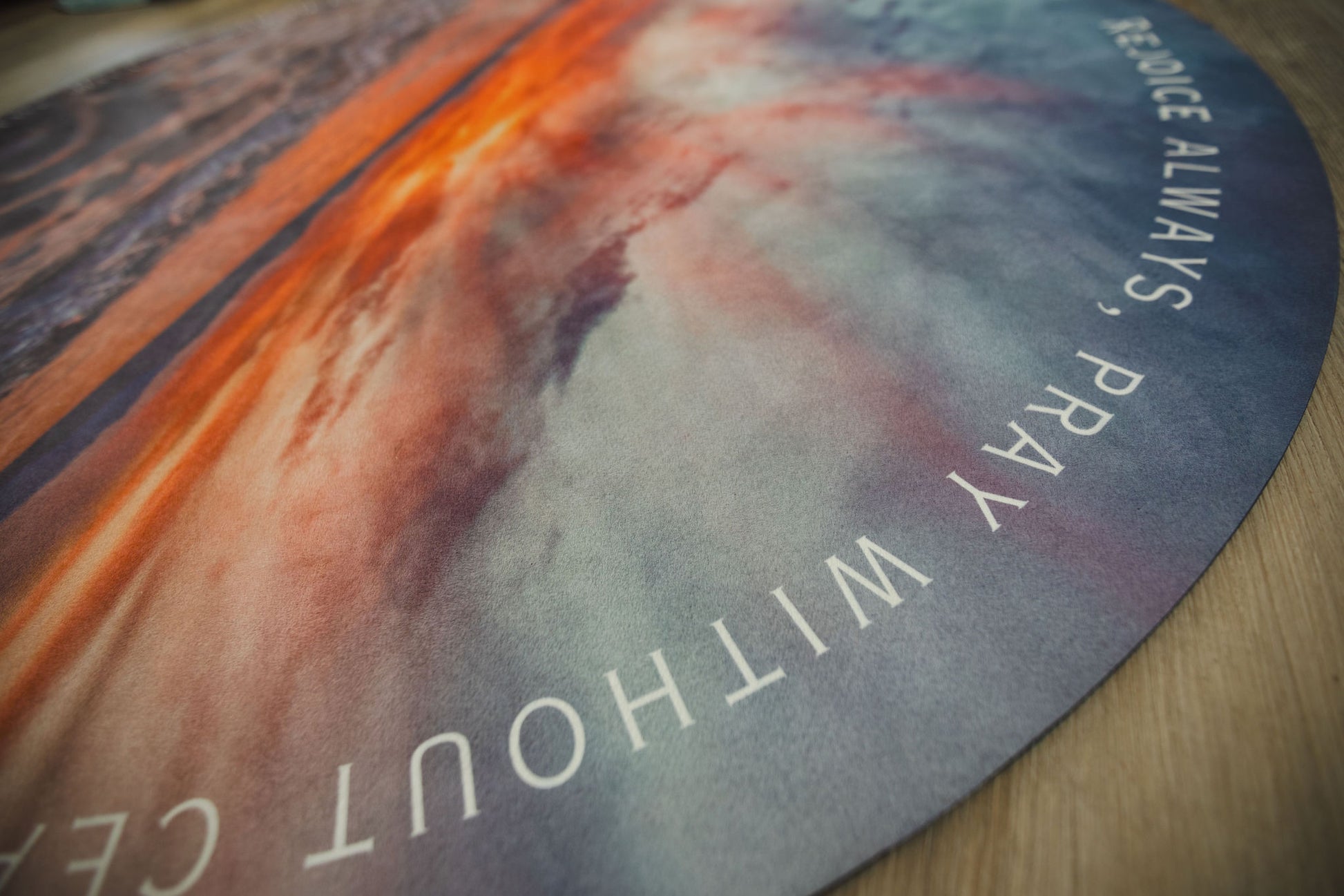 Close-up of a prayer mat with text and abstract design