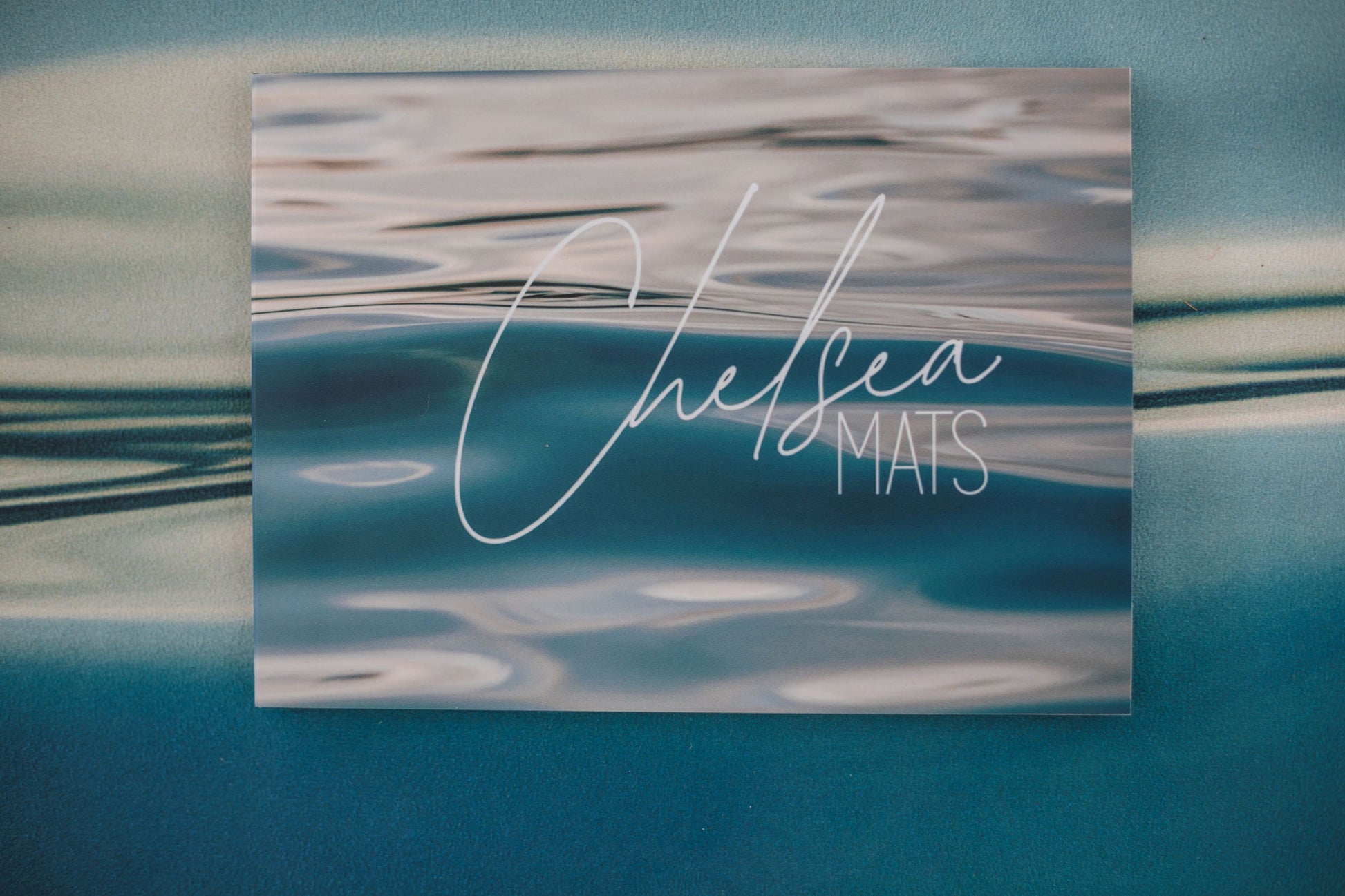 Card with 'Chelsea Mats' text on a workout fitness mat