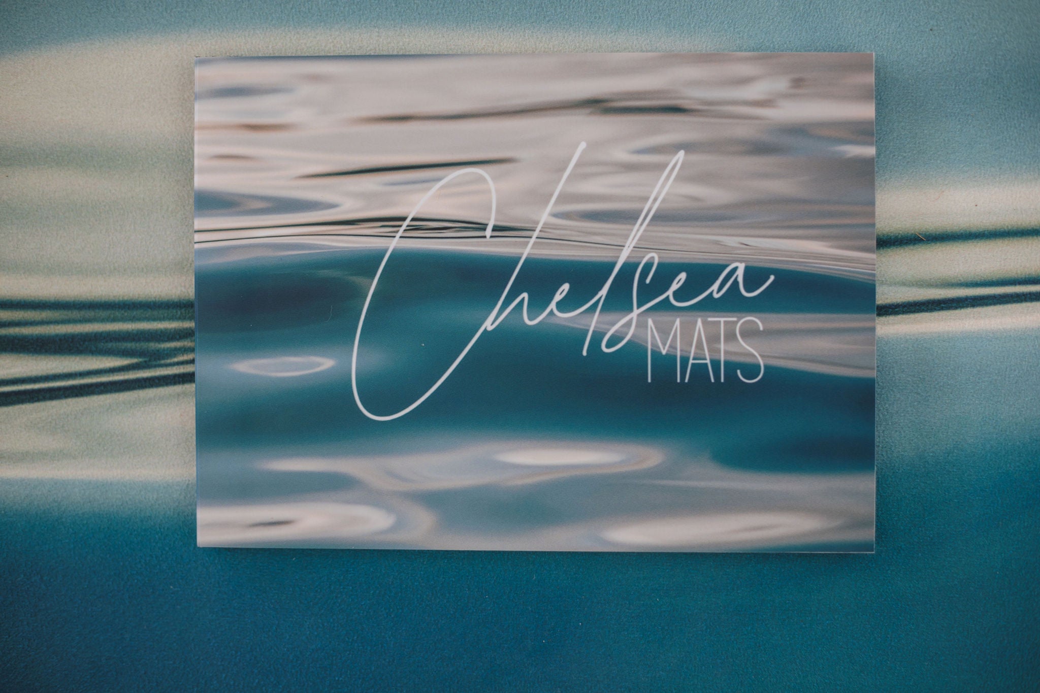 Card with 'Chelsea Mats' text on a workout fitness mat
