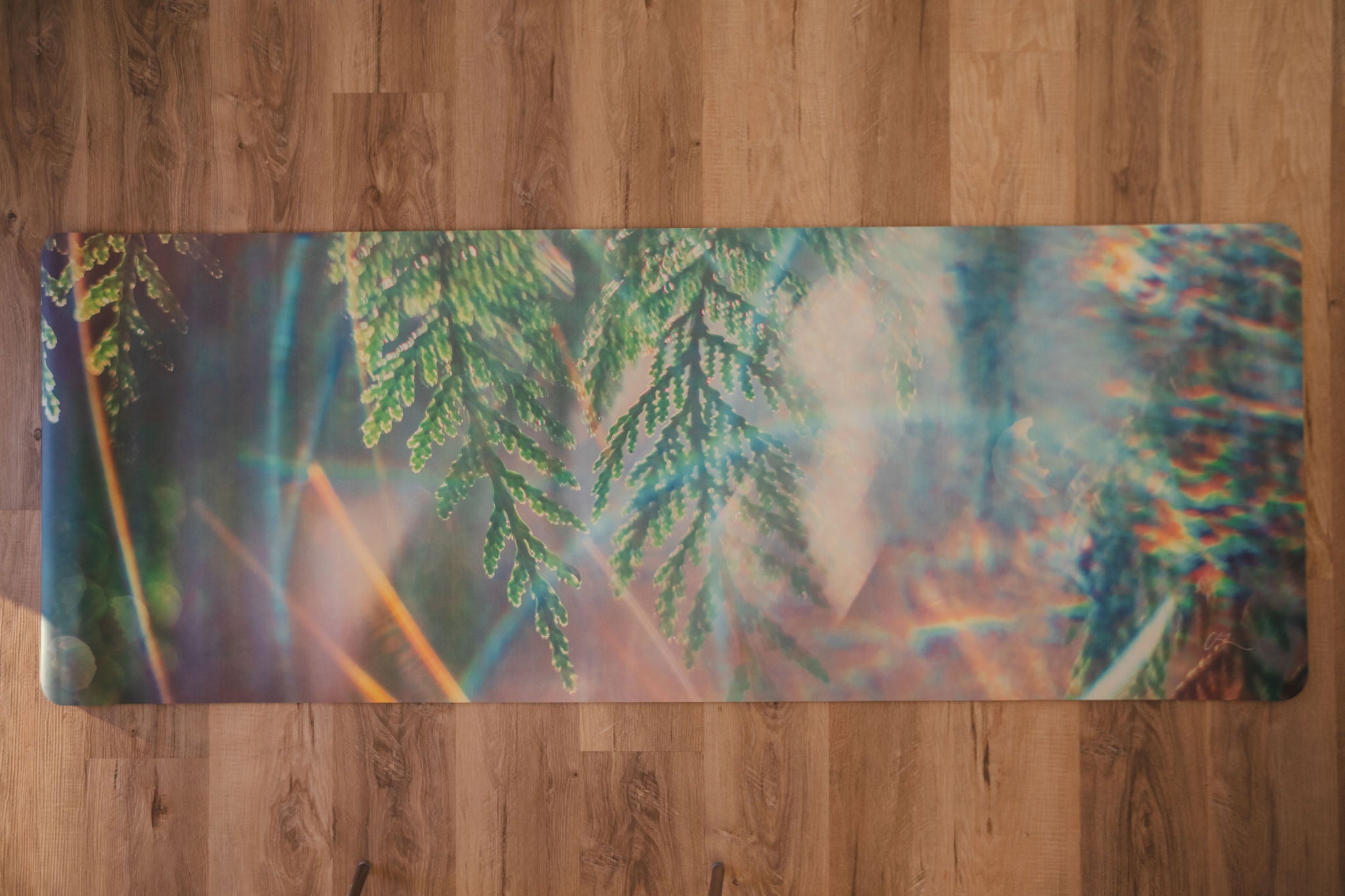 Yoga mat with nature design on a wooden floor
